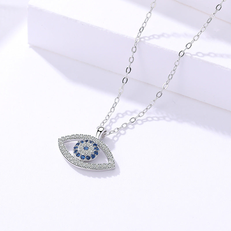 Silver evil eye pendant necklace with blue zircon