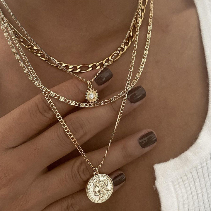 Gold layered coin charm necklace