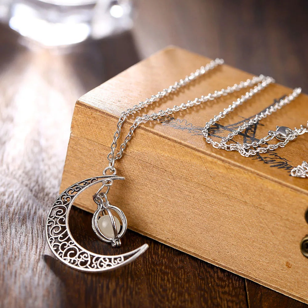 Crescent moon necklace with glowing stone