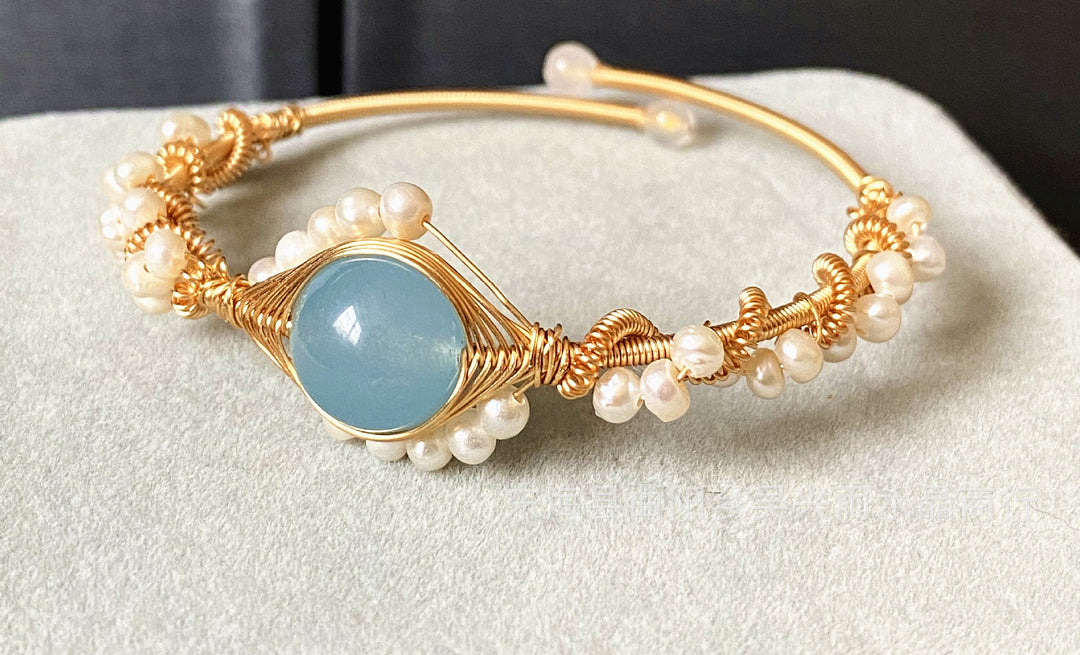 Gold braided wire cuff bracelet with pearls