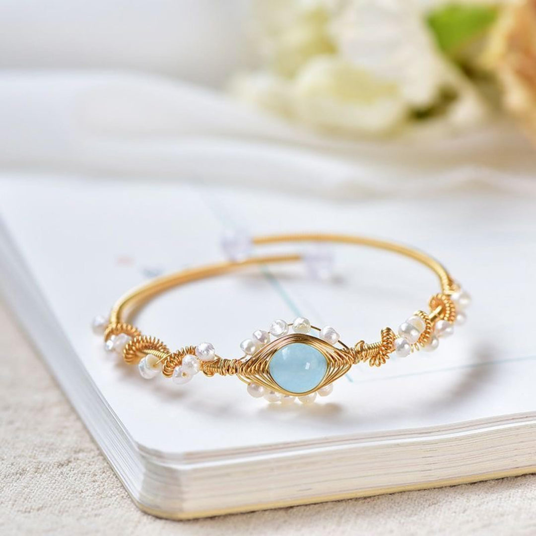 Gold braided wire cuff bracelet with pearls