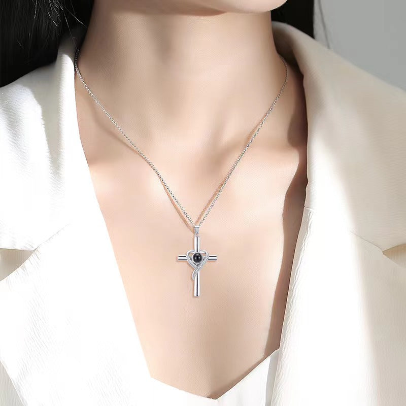 Gold cross heart projection necklace