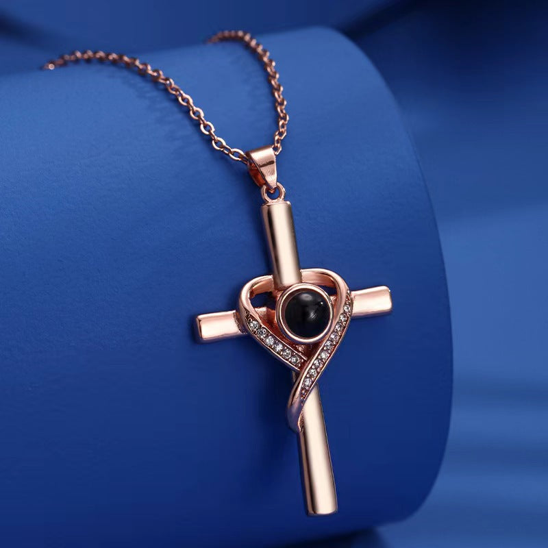 Gold cross heart projection necklace