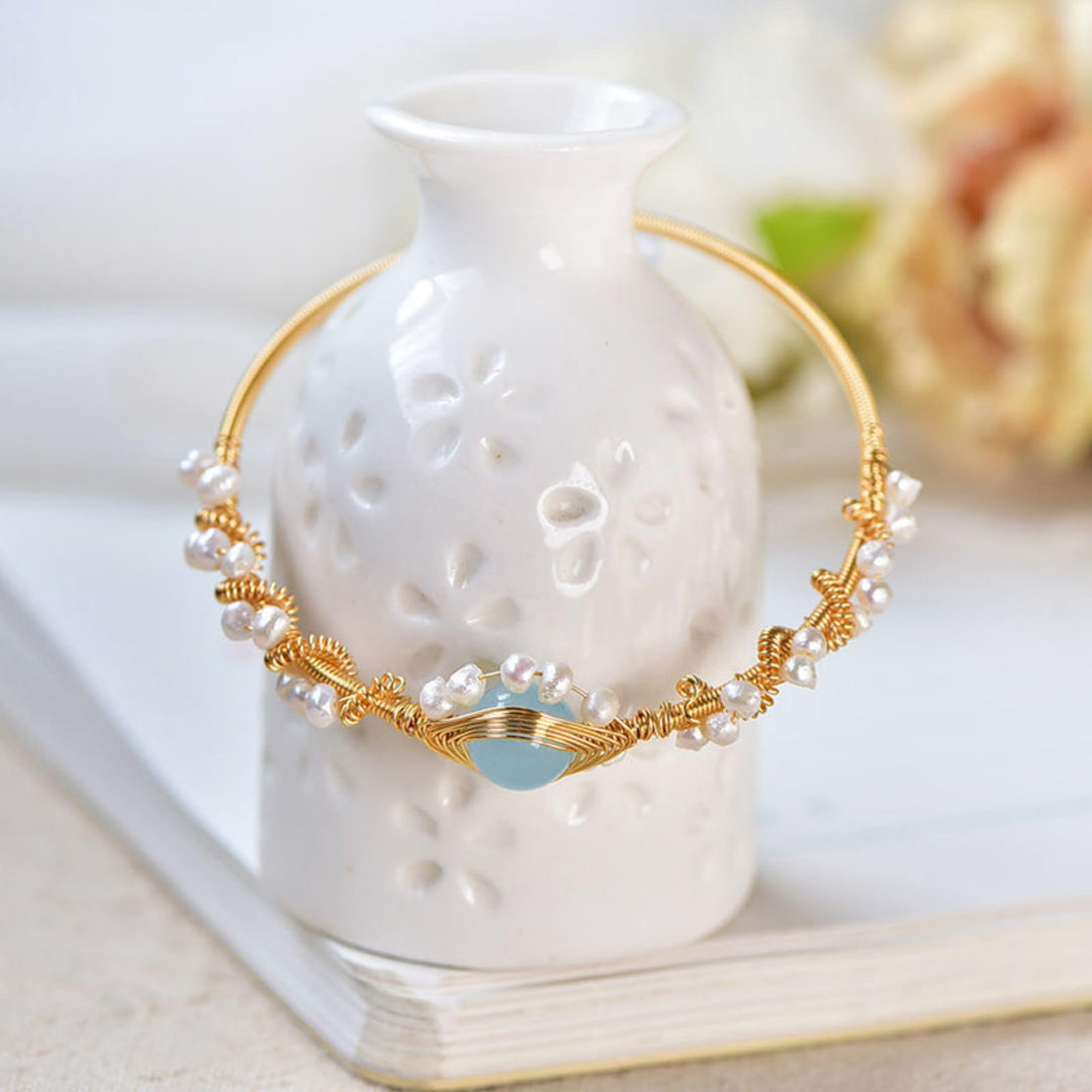 Gold braided wire cuff bracelet with pearls
